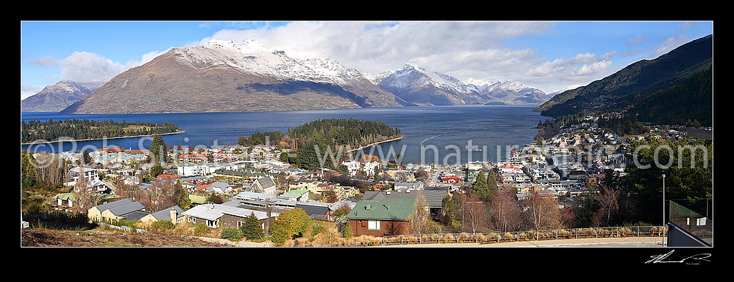 Image of Panorama looking over Queenstown town and Lake Wakatipu. Snow on mountains in distance, Queenstown, Queenstown Lakes District, Otago Region, New Zealand (NZ) stock photo image