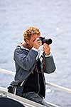 Tourist with camera on boat