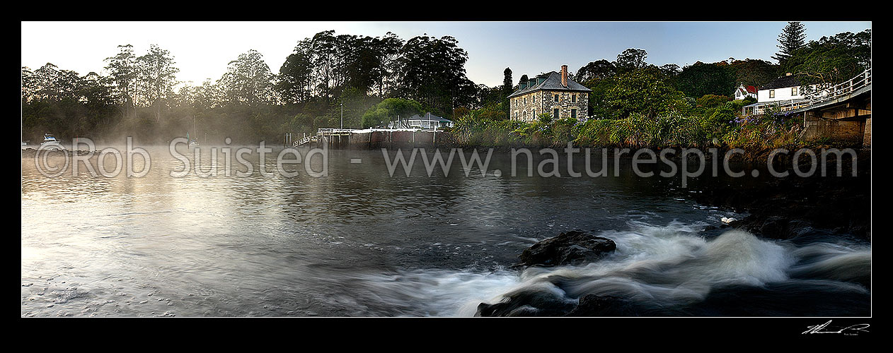 Image of Historic Stone Store (1832) and Mission Station Kemp House (1821). Early misty morning, Kerikeri Inlet Basin and River. Panoramic view, Kerikeri, Far North District, Northland Region, New Zealand (NZ) stock photo image