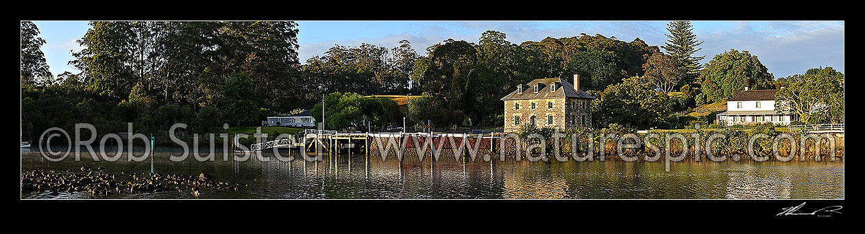 Image of Historic Stone Store (1832) and Mission Station Kemp House (1821-right). Early morning, Kerikeri Inlet Basin. Wide panoramic view, Kerikeri, Far North District, Northland Region, New Zealand (NZ) stock photo image