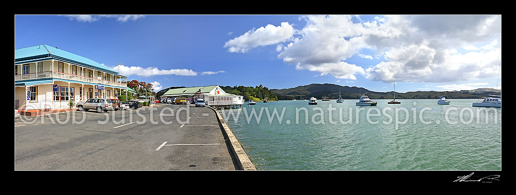 Image of Main street waterfront of Mangonui town at Whites Point with Hotel on Mangonui Harbour. Historic buildings and yachts, Mangonui, Far North District, Northland Region, New Zealand (NZ) stock photo image