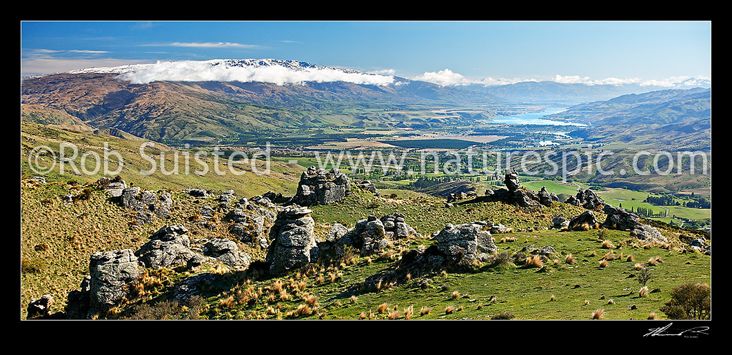 Image of Panorama looking down on Cromwell, Ripponvale, the Clutha River Valley and Lake Dunstan from the Carrick Range. Pisa Range left. Rock tors, Bannockburn, Central Otago District, Otago Region, New Zealand (NZ) stock photo image