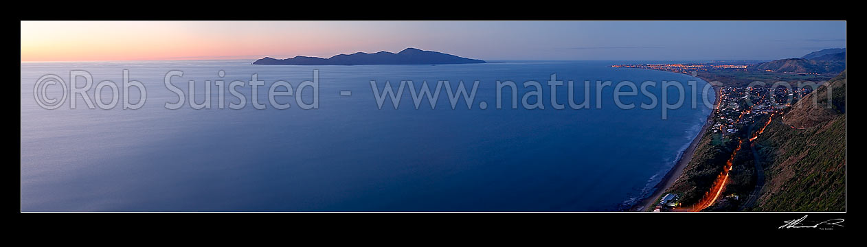 Image of Panorama over the Kapiti Coast, Paekakariki to Paraparaumu and Kapiti Island at twilight. Car and town lights visible, Paekakariki, Kapiti Coast District, Wellington Region, New Zealand (NZ) stock photo image