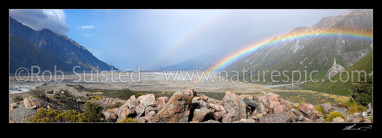 Image of Panorama view of Tasman Valley and double rainbows from lateral morraine. Glacier terminal lake and Burnett mountains left, Mount Cook Range right, Mount Cook, MacKenzie District, Canterbury Region, New Zealand (NZ) stock photo image