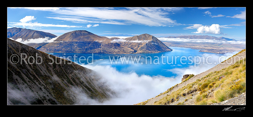 Image of Lake Ohau with moody morning clouds, mist and sunlight. Mt Ben Ohau centre and Range left. Mackenzie basin right, Lake Ohau, Twizel, Waitaki District, Canterbury Region, New Zealand (NZ) stock photo image