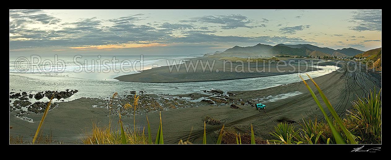 Image of Marokopa beach and river mouth. Wild west coast at sunset with 4wd and tracks on beach. Black iron sand. Looking north from river mouth with town at right. Moody panorama, Marokopa, Waitomo District, Waikato Region, New Zealand (NZ) stock photo image