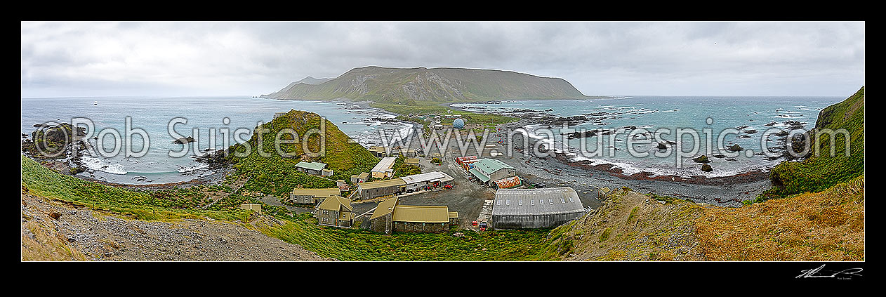 Image of ANARE station and living quarters on the isthmus at Macquarie Island from Wireless Hill. Buckles Bay left, Hasselborough Bay right. 180 degree panorama during tourist cruise ship visit, Macquarie Island, NZ Sub Antarctic District, NZ Sub Antarctic Region, Australia stock photo image