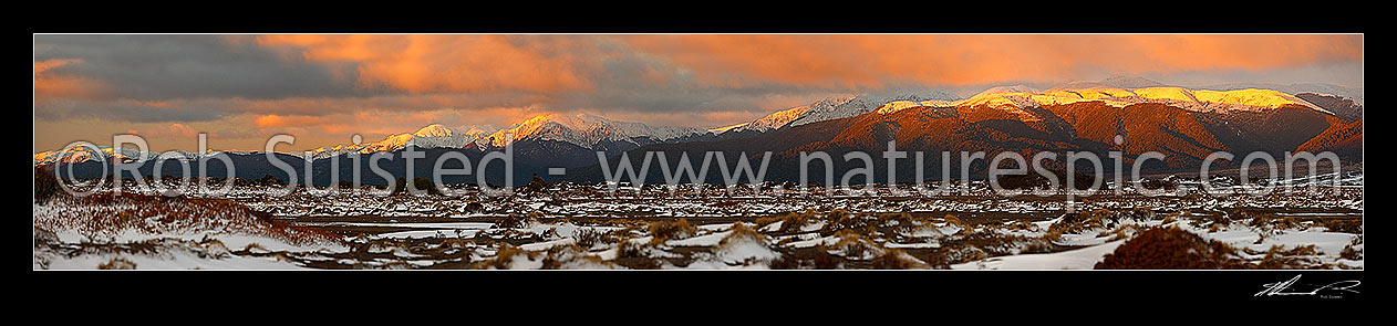 Image of Kaimanawa Ranges with winter evening light at sunset. Looking across the Rangipo Desert in snow to the Kaimanawa Mountains Ranges. Panorama, Kaimanawa Forest Park, Taupo District, Waikato Region, New Zealand (NZ) stock photo image