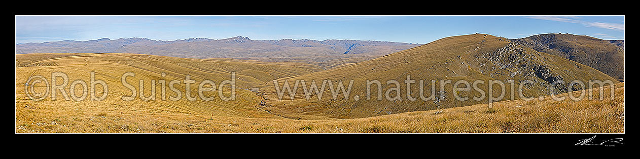 Image of Old Man Range. Looking towards Potters & Garvie Mountains from Waikaia Bush Road. Campbell Creek with historic water races for gold mining right. 1500 masl. Panorama, Alexandra, Central Otago District, Otago Region, New Zealand (NZ) stock photo image