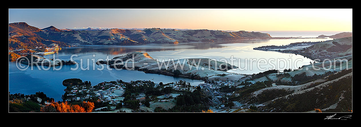 Image of Otago Harbour on frosty winter morning from above Portobello. Port Chalmers left. Harwood, Aramoana and Taiaroa Head far right at harbour entrance. Panorama, Otago Peninsula, Dunedin City District, Otago Region, New Zealand (NZ) stock photo image