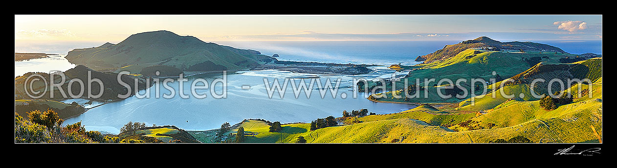 Image of Otago Peninsula farmland and beaches around Hoopers Inlet. Allans Beach centre, Papanui Inlet left, and Sandy Mount right. Panorama, Otago Peninsula, Dunedin City District, Otago Region, New Zealand (NZ) stock photo image