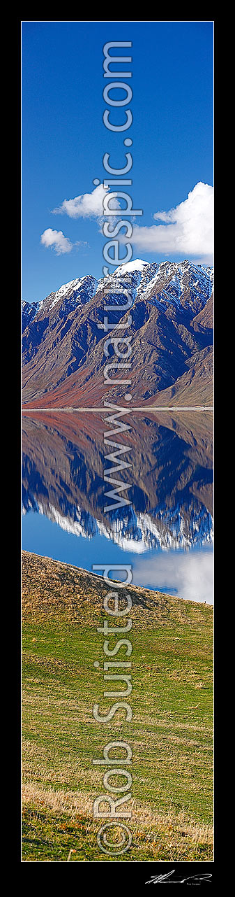 Image of Lake Hawea on a perfect calm spring/winter day reflecting the surrounding snowy ranges. Vertical panorama, Hawea, Queenstown Lakes District, Otago Region, New Zealand (NZ) stock photo image