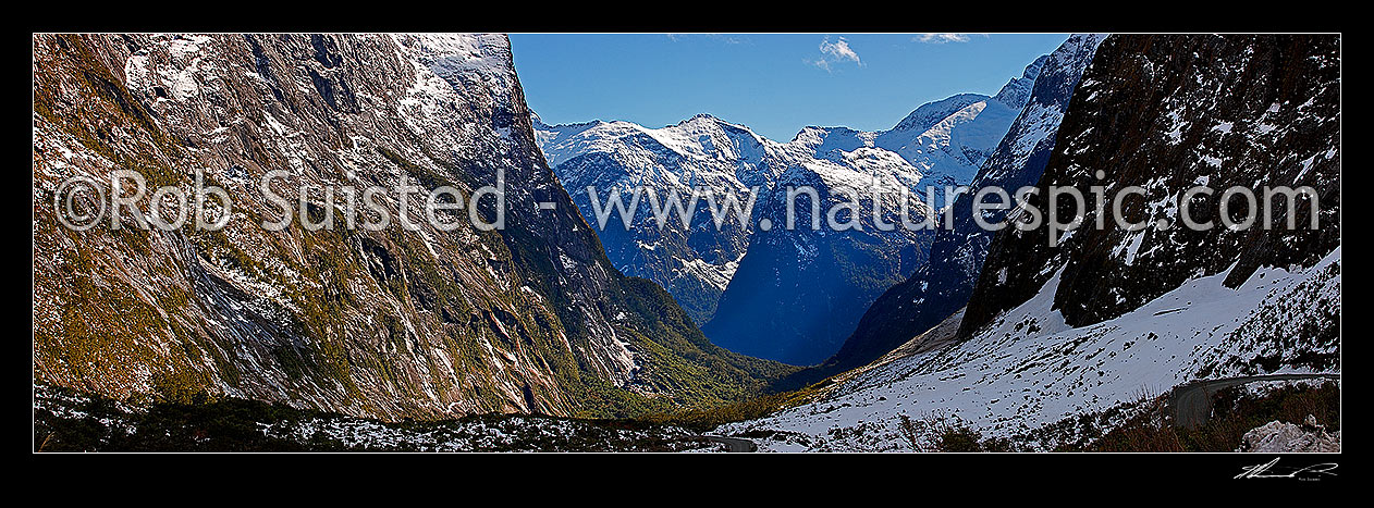 Image of Milford Sound Road, looking down the Cleddau Valley from Homer Tunnel, Darran Mountains. State Highway 94 in winter. Sheerdown Hills in centre distance. Panorama, Milford Sound, Fiordland National Park, Southland District, Southland Region, New Zealand (NZ) stock photo image