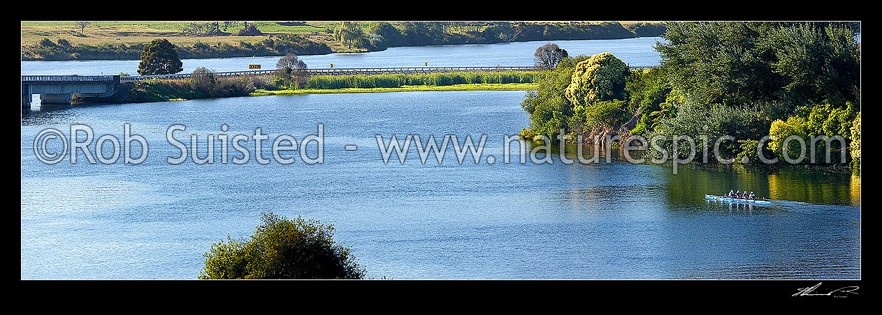 Image of Lake Karapiro with rowing teams of rowers training on lake with support boats and coaches. Panorama, Lake Karapiro, Cambridge, Waipa District, Waikato Region, New Zealand (NZ) stock photo image