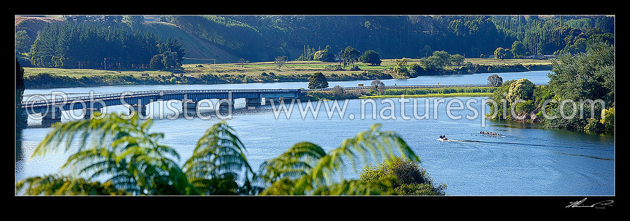 Image of Lake Karapiro with rowing teams of rowers training on lake with support boats and coaches. Panorama, Lake Karapiro, Cambridge, Waipa District, Waikato Region, New Zealand (NZ) stock photo image