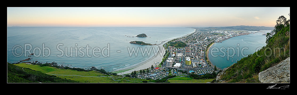 Image of View from Mt Maunganui (232m) over beach and Moturiki and Motuotau Islands, towards Papamoa, Tauranga Harbour right. Panorama at dusk, Mount Maunganui, Tauranga District, Bay of Plenty Region, New Zealand (NZ) stock photo image