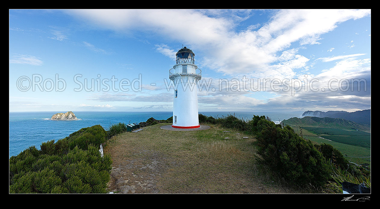 Image of East Cape lighthouse on hill (141m) above East Island (Whangoakeno) left, Waikori Bluff distant right. Panorama, East Cape, Gisborne District, Gisborne Region, New Zealand (NZ) stock photo image