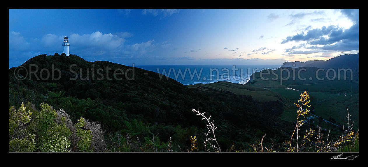 Image of East Cape lighthouse at dusk, Waikori Bluff distant right. Panorama, East Cape, Gisborne District, Gisborne Region, New Zealand (NZ) stock photo image