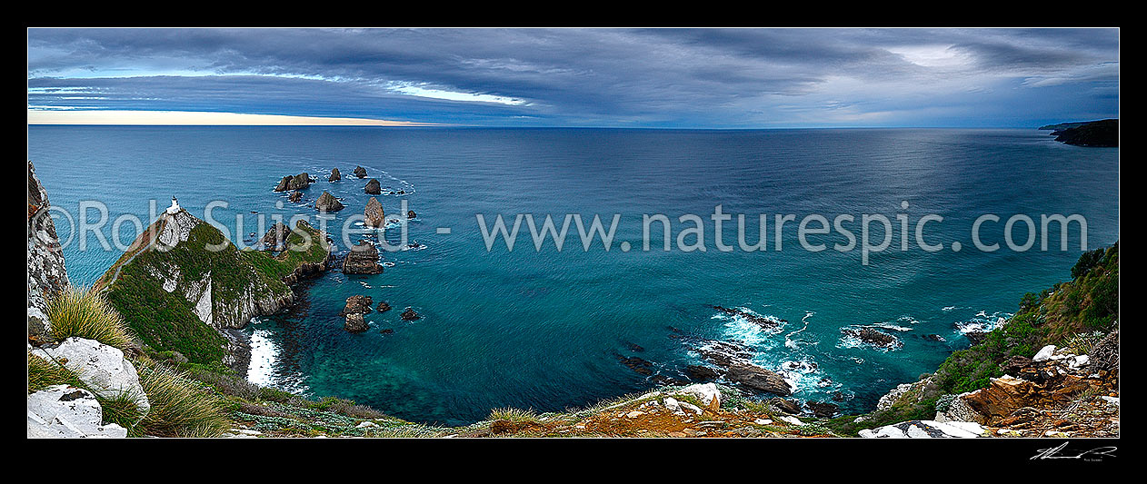 Image of Nuggets Lighthouse at dusk. Nugget point and Tokata Point left and Long Point right, Catlins. South Otago Panorama, Catlins, Clutha District, Otago Region, New Zealand (NZ) stock photo image