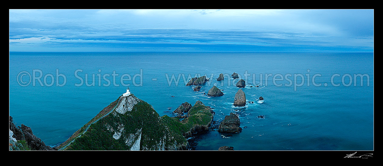 Image of Nuggets Lighthouse at dusk. Nugget point and Tokata Point, South Otago Panorama, Catlins, Clutha District, Otago Region, New Zealand (NZ) stock photo image