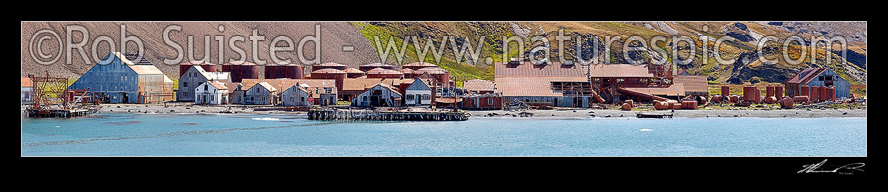 Image of Stromness, former whaling station panorama, famous as destination of Ernest Shackleton's epic rescue journey 1916. Whaling station's manager villa at left, Stromness, South Georgia stock photo image