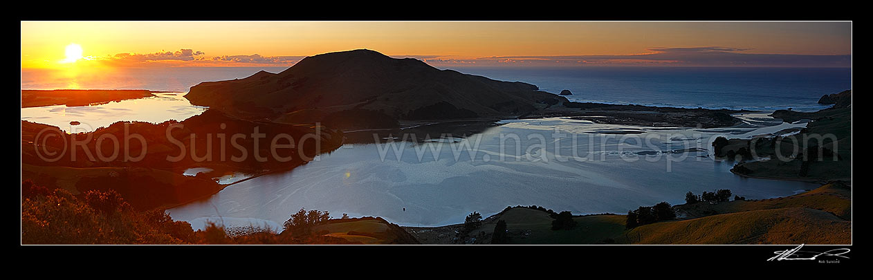 Image of Otago Peninsula farmland and beaches around Hoopers Inlet. Allans Beach centre, Papanui Inlet left, and Sandy Mount right. Sunrise panorama, Otago Peninsula, Dunedin City District, Otago Region, New Zealand (NZ) stock photo image