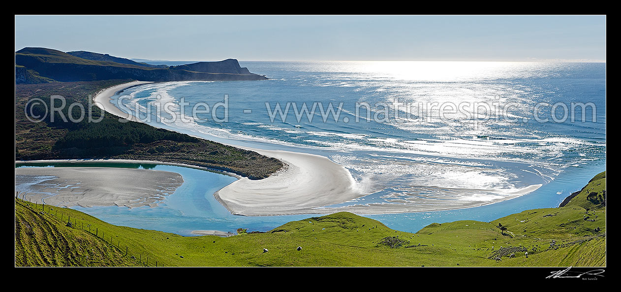 Image of Looking across farmland to Okia Flat, Victory Beach and Wickliffe Bay to Te Whakarekaiwi Point. Papanui Inlet centre left. Panorama, Otago Peninsula, Dunedin City District, Otago Region, New Zealand (NZ) stock photo image