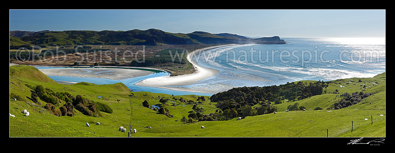 Image of Looking across farmland to Okia Flat, Victory Beach and Wickliffe Bay to Te Whakarekaiwi Point. Papanui Inlet centre left. Panorama, Otago Peninsula, Dunedin City District, Otago Region, New Zealand (NZ) stock photo image