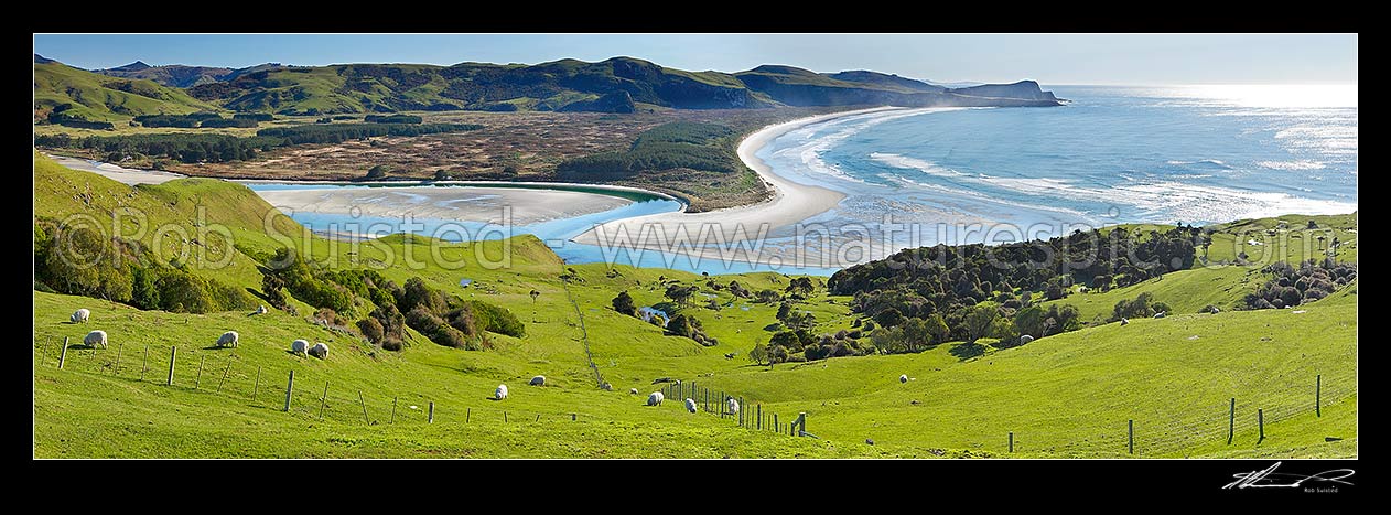 Image of Looking across farmland to Okia Flat, Victory Beach and Wickliffe Bay to Te Whakarekaiwi Point. Papanui Inlet centre left. Panorama, Otago Peninsula, Dunedin City District, Otago Region, New Zealand (NZ) stock photo image