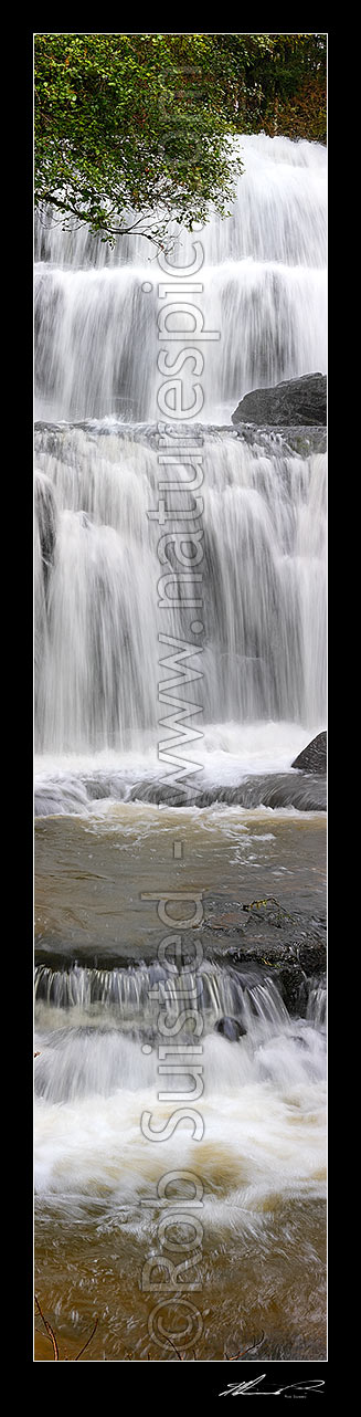 Image of Waterfall cascading over several falls into pool. Purakaunui River falls. Vertical panorama, Catlins, Clutha District, Otago Region, New Zealand (NZ) stock photo image