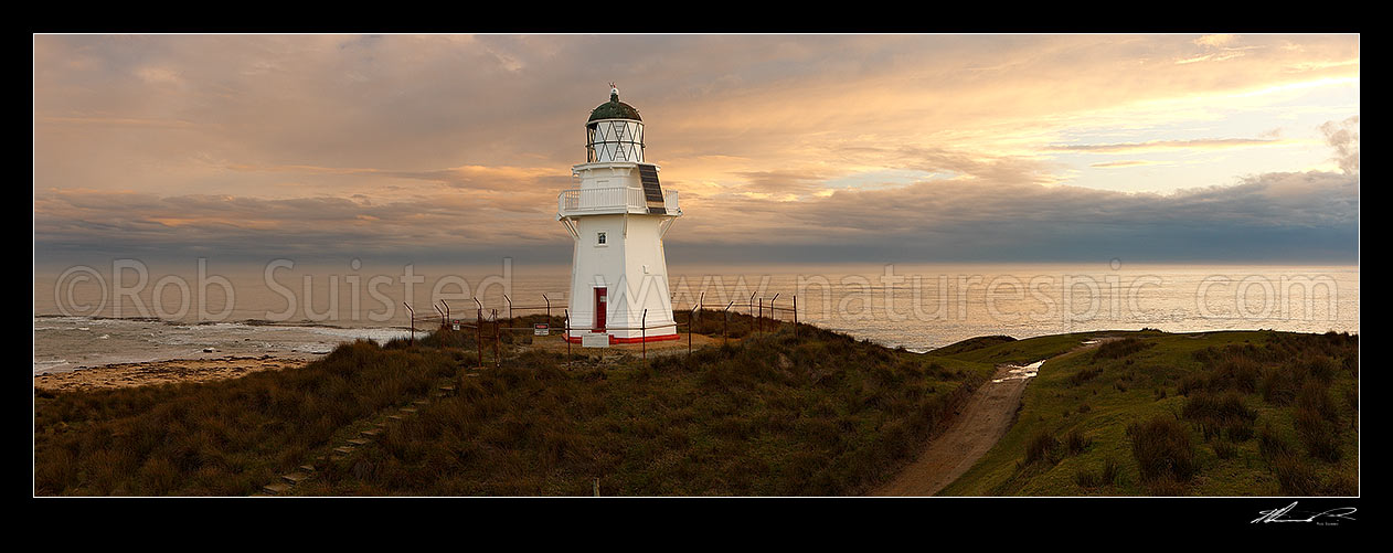 Image of Waipapa Point lighthouse and beach panorama on a moody evening, Fortrose, Southland District, Southland Region, New Zealand (NZ) stock photo image