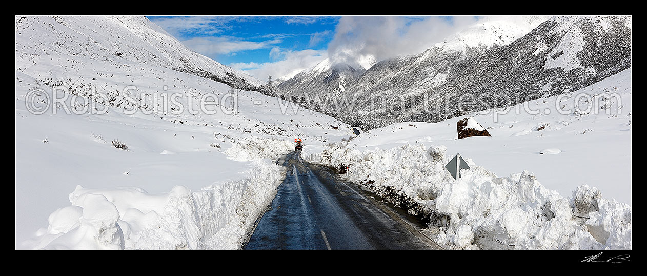 Image of Arthur's Pass road in heavy winter snow. State Highway 73 to West Coast. Looking east with road clearing machinery working. Panorama, Arthur's Pass National Park, Selwyn District, Canterbury Region, New Zealand (NZ) stock photo image