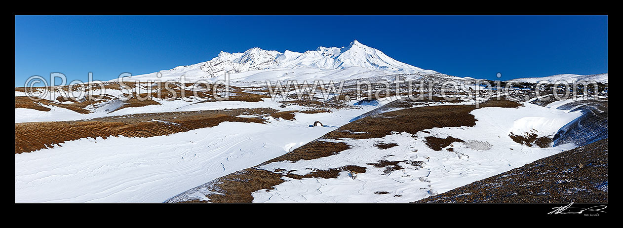 Image of Mount Ruapehu above Rangipo desert in winter snow. Round the Mountain (Mt Ruapehu) Track, Tongariro National Park, Ruapehu District, Manawatu-Wanganui Region, New Zealand (NZ) stock photo image