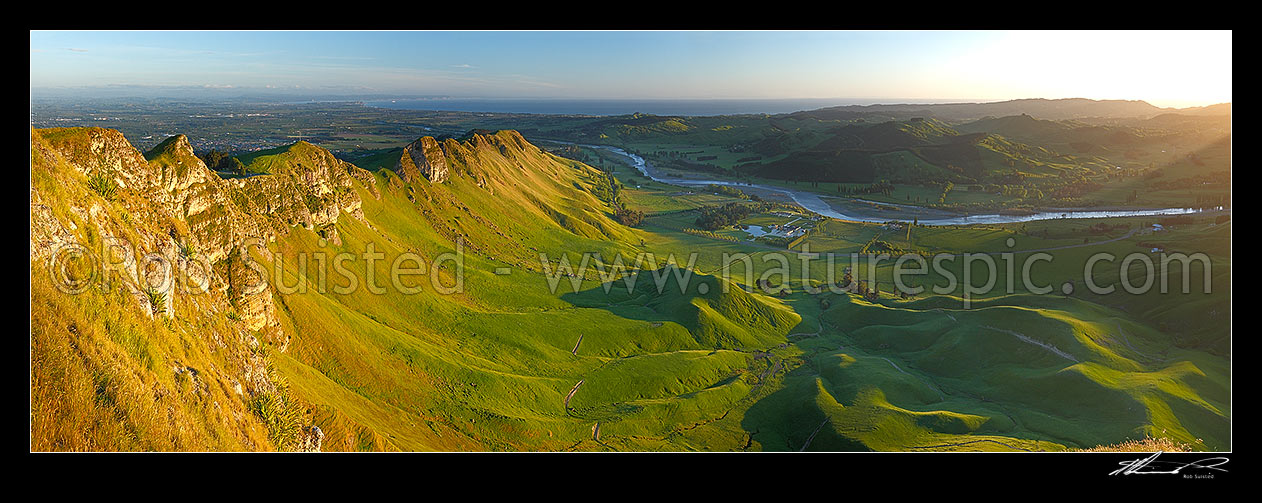 Image of Sunrise on Te Mata Peak (399m). Overlooking Hawke Bay and the Tukituki River with Napier far left. Panorama, Hawke's Bay, Hastings District, Hawke's Bay Region, New Zealand (NZ) stock photo image