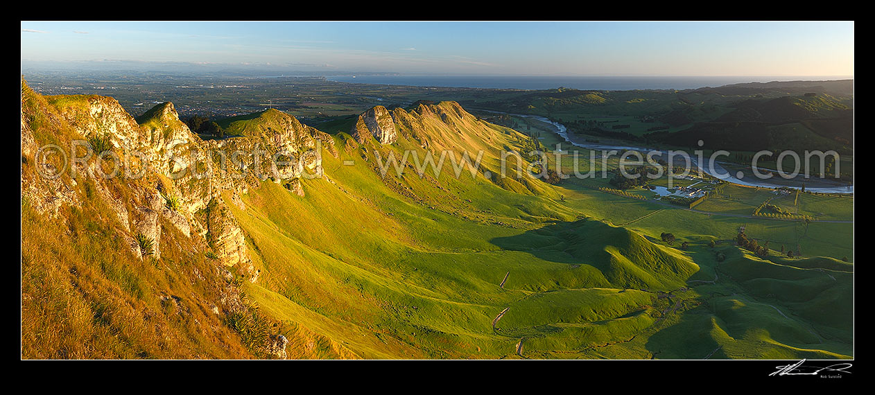 Image of Sunrise on Te Mata Peak (399m). Overlooking Hawke Bay and the Tukituki River with Napier far left. Panorama, Hawke's Bay, Hastings District, Hawke's Bay Region, New Zealand (NZ) stock photo image