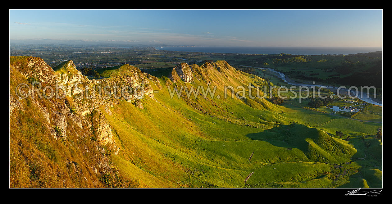 Image of Sunrise on Te Mata Peak (399m). Overlooking Hawke Bay and the Tukituki River with Napier far left. Panorama, Hawke's Bay, Hastings District, Hawke's Bay Region, New Zealand (NZ) stock photo image