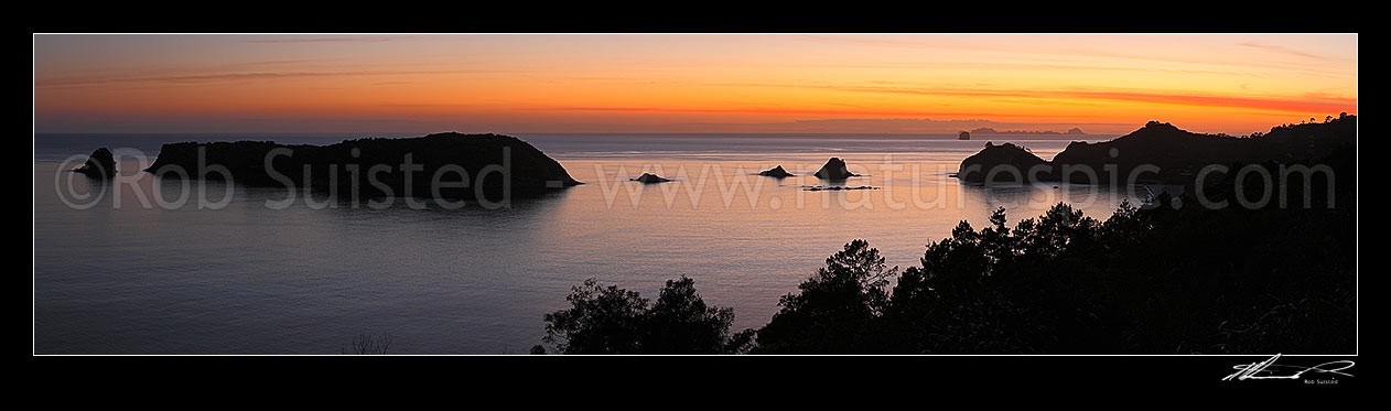 Image of Sunrise over Hahei Beach. Okorotere Is. And Mahurangi (Goat) Island left, Wigmore Pass and Te Karaka Is. Centre and Hereheretaura Point right. The Aldermen Islands beyond. Peaceful morning panorama, Hahei, Coromandel Peninsula, Thames-Coromandel District, Waikato Region, New Zealand (NZ) stock photo image