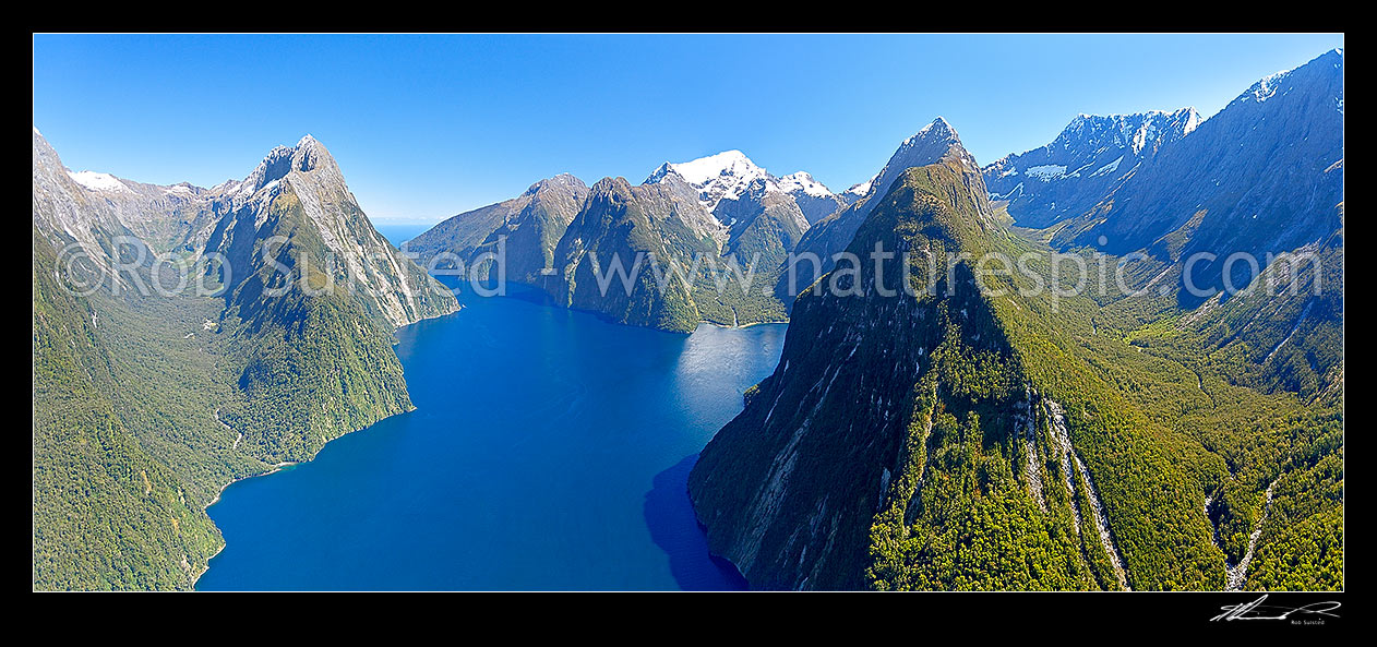 Image of Milford Sound aerial view. Sinbad Gully & Mitre Peak (1683m) left, The Lion, Mt Pembroke and Harrison Cove centre, with Bowen River and Mt Grave right. Piopiotahi. Panorama, Milford Sound, Fiordland National Park, Southland District, Southland Region, New Zealand (NZ) stock photo image