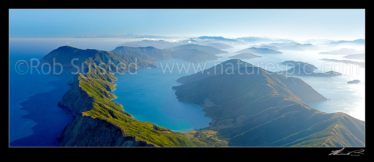 Image of Arapawa Island and Marlborough Sounds aerial panorama. Onauku Bay in East Bay off Queen Charlotte Sounds. Kaikoura Ranges and Cloudy Bay distant, Cook Strait, Marlborough District, Marlborough Region, New Zealand (NZ) stock photo image