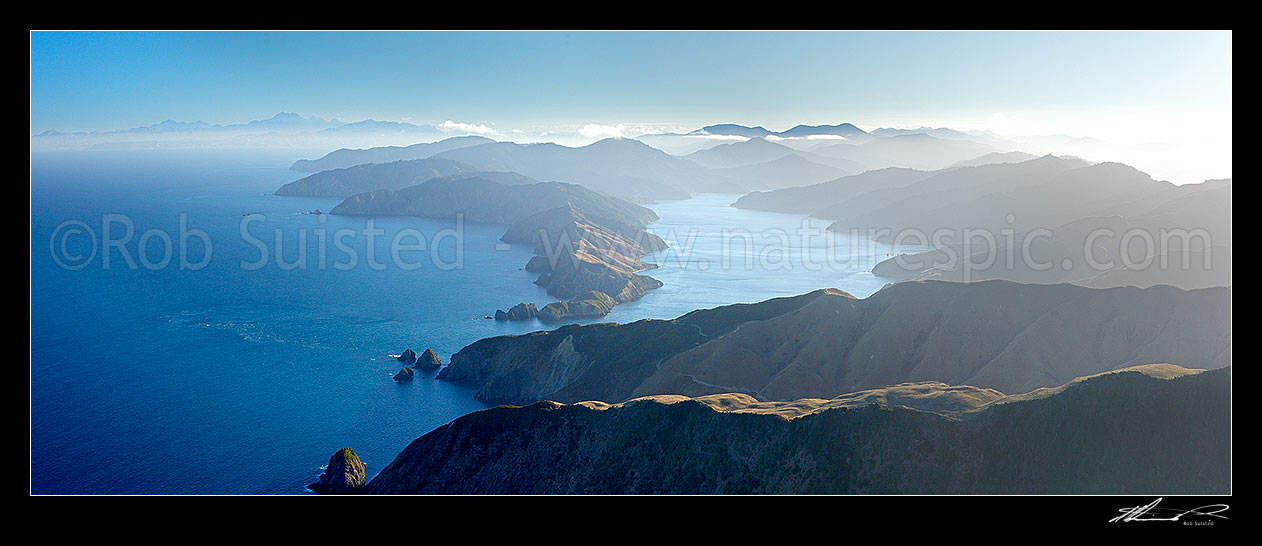 Image of Tory Channel entrance between East Head and West Head into Cook Strait. Kaikoura Mountain Ranges far left, Arapawa Island right. Aerial panorama, Arapawa Island, Marlborough Sounds, Marlborough District, Marlborough Region, New Zealand (NZ) stock photo image