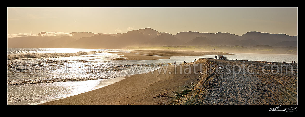 Image of Lake Onoke entrance and Ruamahanga River mouth in Palliser Bay with fishermen and whitebaiters in evening. Remutaka (Rimutaka) Ranges beyond. Panorama, Lake Ferry, South Wairarapa District, Wellington Region, New Zealand (NZ) stock photo image