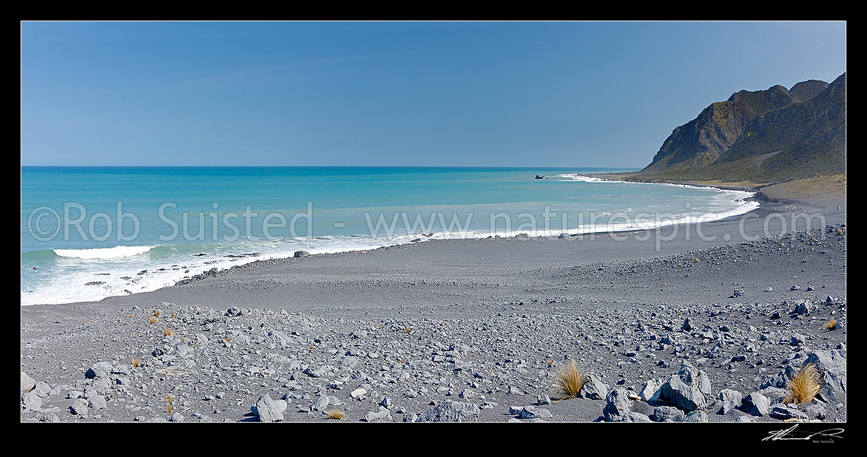 Image of Ngapotiki shingle fan and coastline west of Cape Palliser. Aorangi Range rising from the sea. Panorama, Cape Palliser, South Wairarapa District, Wellington Region, New Zealand (NZ) stock photo image