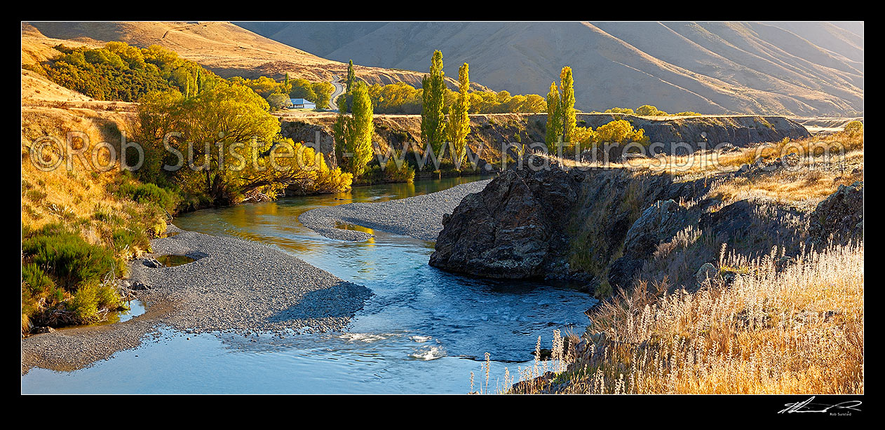 Image of Acheron Accommodation house by the Clarence River, historic cobb construction. Autumn colours on trees. Panorama, Molesworth Station, Hurunui District, Canterbury Region, New Zealand (NZ) stock photo image