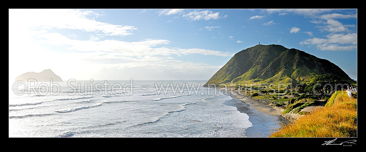 Image of East Cape lighthouse and East Island (Wharekeno), and coastline below East Coast Road. Panorama, East Cape, Gisborne District, Gisborne Region, New Zealand (NZ) stock photo image