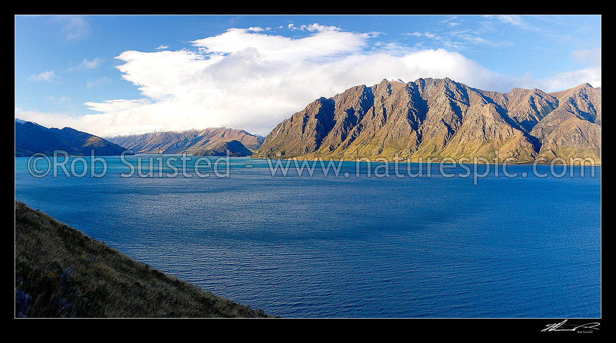 Image of Lake Hawea, looking up the lake towards The Peninsula and the Dingle Burn (left). Panorama, Lake Hawea, Otago, Queenstown Lakes District, Otago Region, New Zealand (NZ) stock photo image