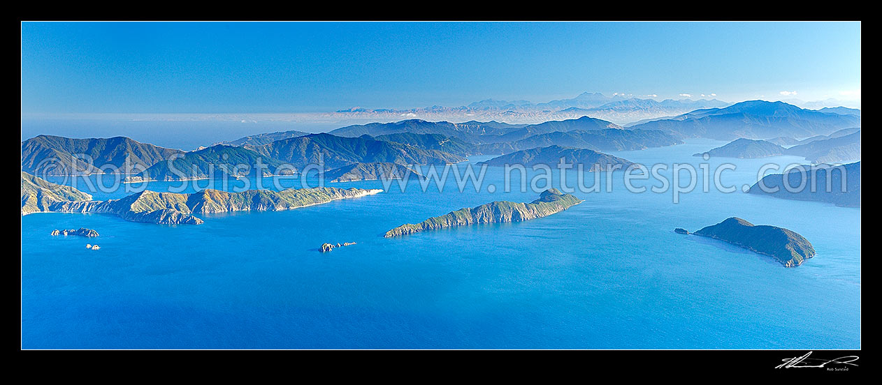 Image of Marlborough Sounds, outer Queen Charlotte Sound, Arapawa Island left, Long Island centre, Motuara Island right. Kaikoura Ranges distant. Aerial panaroma, Marlborough Sounds, Marlborough District, Marlborough Region, New Zealand (NZ) stock photo image