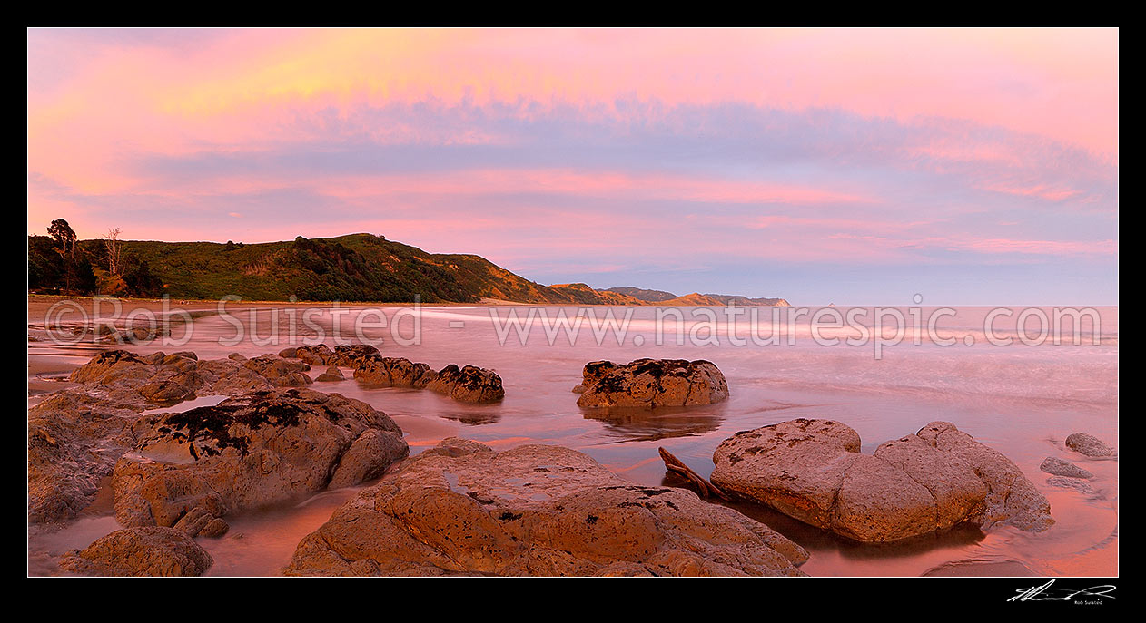 Image of Sunset at Port Awanui and Te Wharau Beach. Whakaumu, East Cape and East Island (Whangaokeno) visible in distance. Panorama, Port Awanui, East Coast, Gisborne District, Gisborne Region, New Zealand (NZ) stock photo image