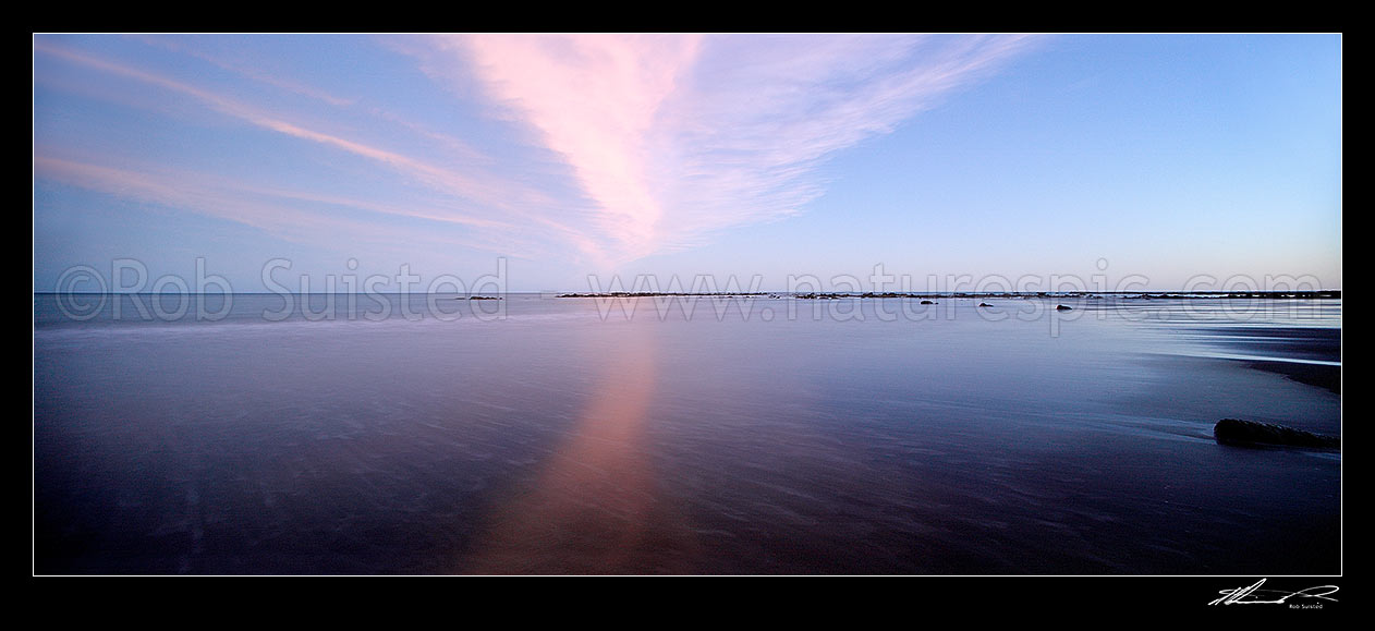 Image of Wispy sunest clouds reflected in beach sands of Port Awanui. Panorama, Port Awanui, East Coast, Gisborne District, Gisborne Region, New Zealand (NZ) stock photo image