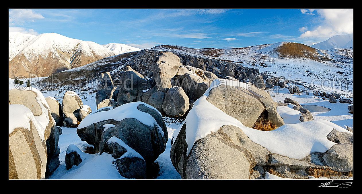 Image of Castle Hill limestone rock climbing area in winter snow with the Torlesse Range at left. Panorama, Castle Hill, Selwyn District, Canterbury Region, New Zealand (NZ) stock photo image