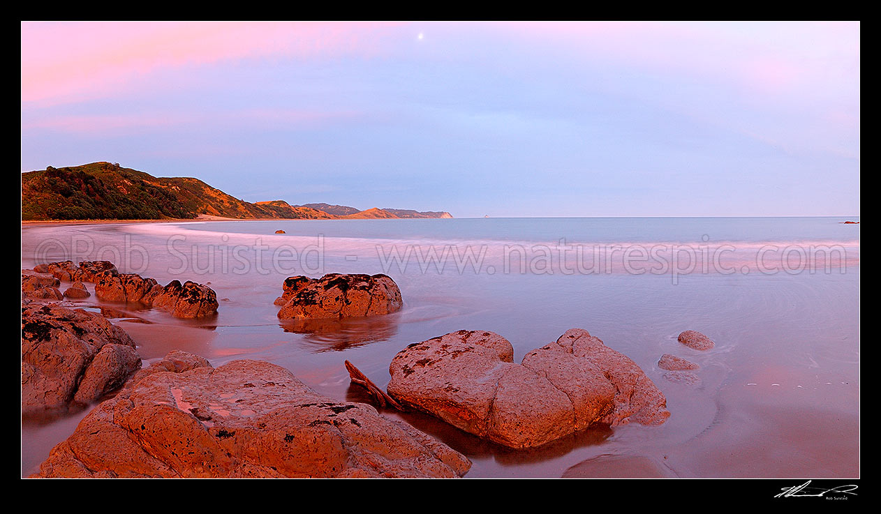 Image of Sunset at Port Awanui and Te Wharau Beach. Whakaumu, East Cape and East Island (Whangaokeno) visible in distance. Panorama, Port Awanui, East Coast, Gisborne District, Gisborne Region, New Zealand (NZ) stock photo image